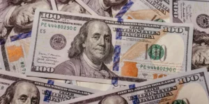 Stack of 100 dollar US banknotes with Benjamin Franklin portrait.